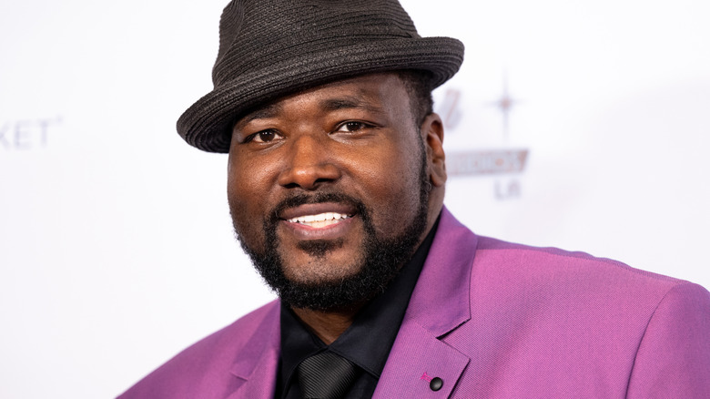 Quinton Aaron glimlacht
